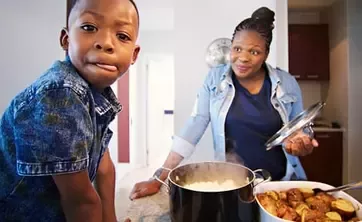 Kind und Elternteil kochen zusammen