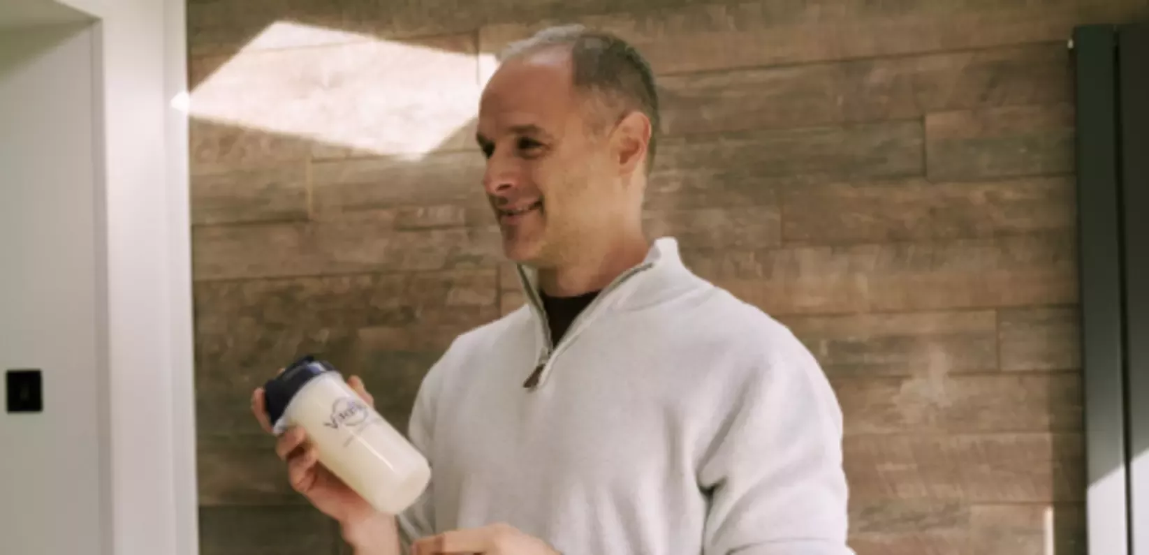 Man with a Vitaflo bottle 